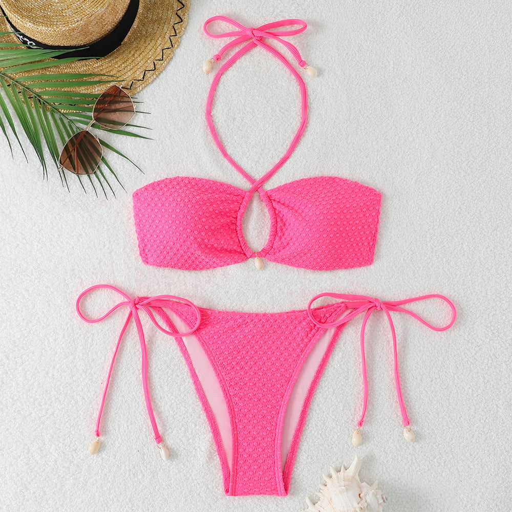 Dame bikini-sæt med innovativt bindemønster og trendy cut-out skovae
