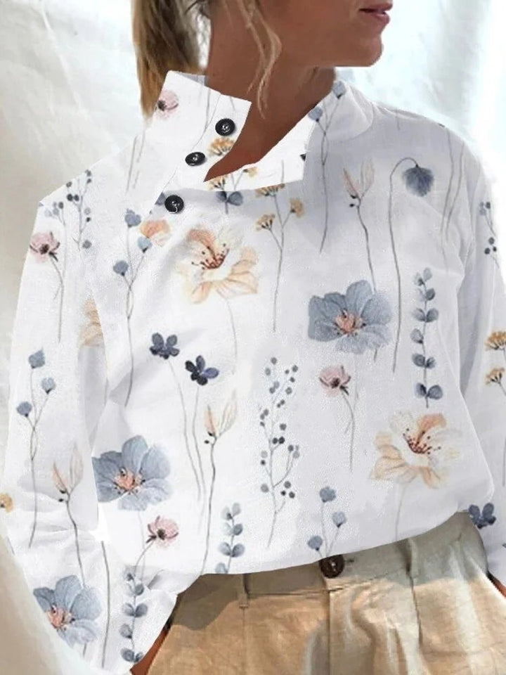 Damebluse med blomsterdesign og knapdetaljer Stilla