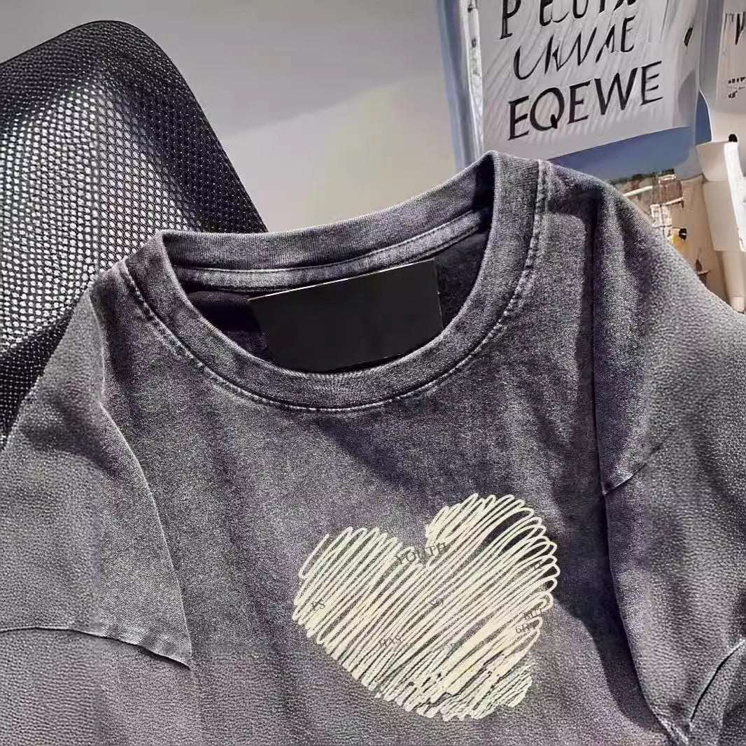 Dame T-shirt med kreativt hjerte-motiv og inspirerende slogan Stilla