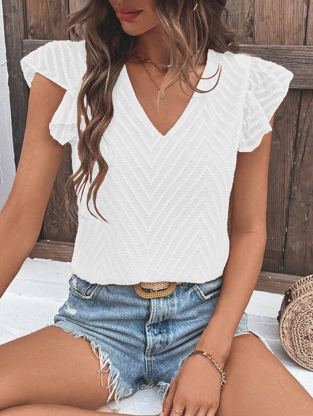 Damebluse med moderne zigzag-mønster og flæsedetaljer Stilla