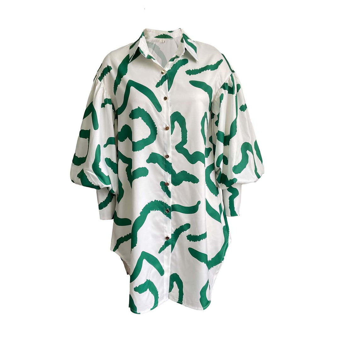 Damebluse med overdimensionerede pufærmer og moderne grafisk design Stilla