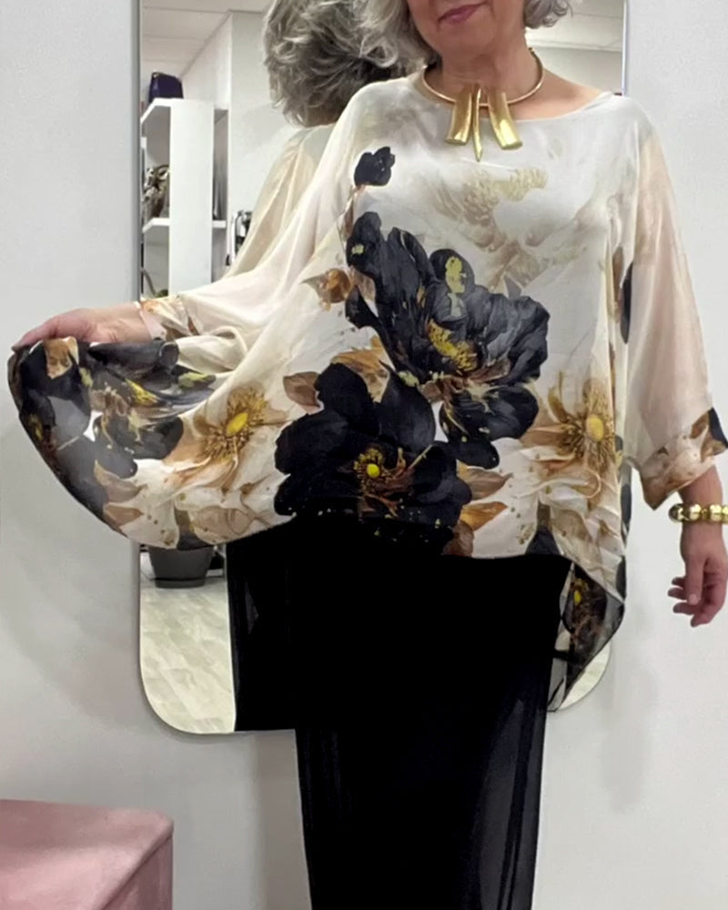 Damebluse med florale accenter og voluminøse ærmer Stilla