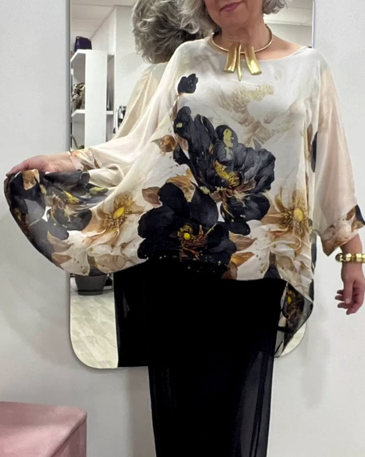 Damebluse med florale accenter og voluminøse ærmer Stilla