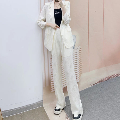 Dame Elegant Blazer-Bukser-Sæt i minimalistisk design med subtile blomsterdetaljer Stilla