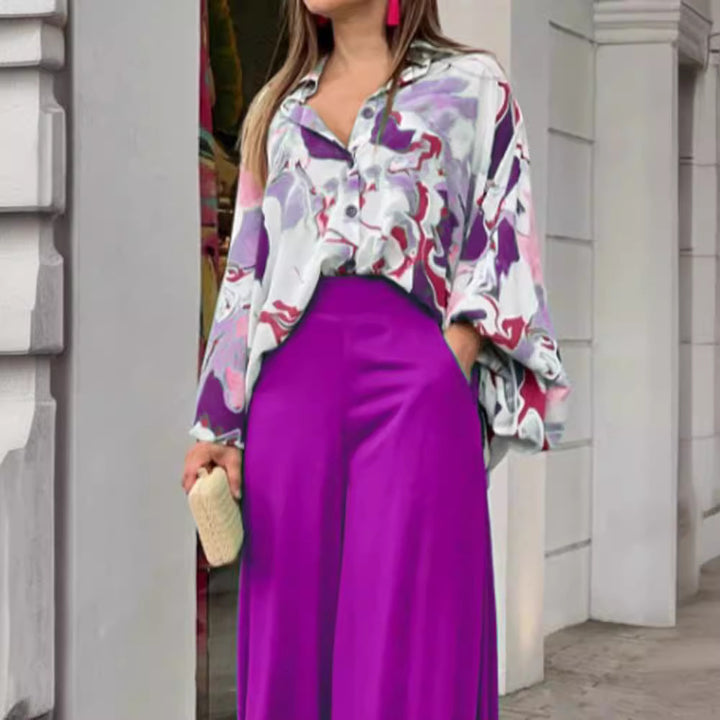 Dame fritidsbluse med farverig marmortryk og loose fit Stilla