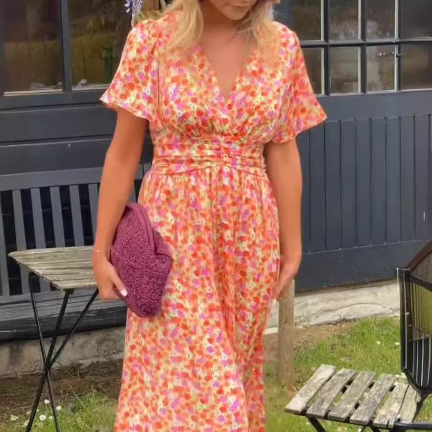 Dame maxikjole med elegant V-udskæring og legesyg puffærme Stilla