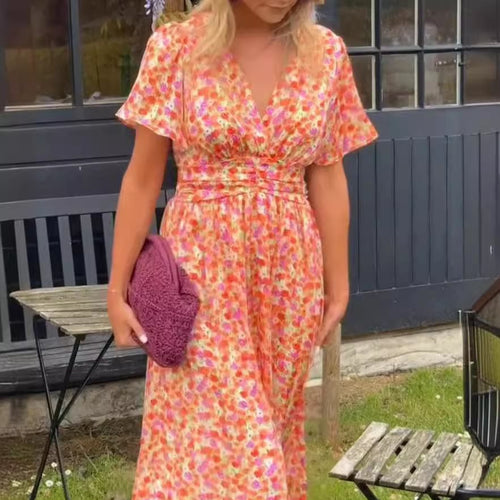 Dame maxikjole med elegant V-udskæring og legesyg puffærme Stilla