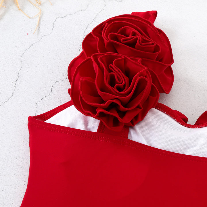 Dame én-delt badedragt med blomstret dekoration og forførende wrap-skjørt Stilla