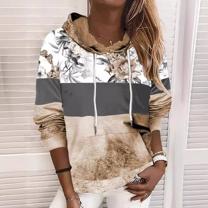 Dame hættetrøje med blomstermotiv og moderne farveblokdesign Stilla