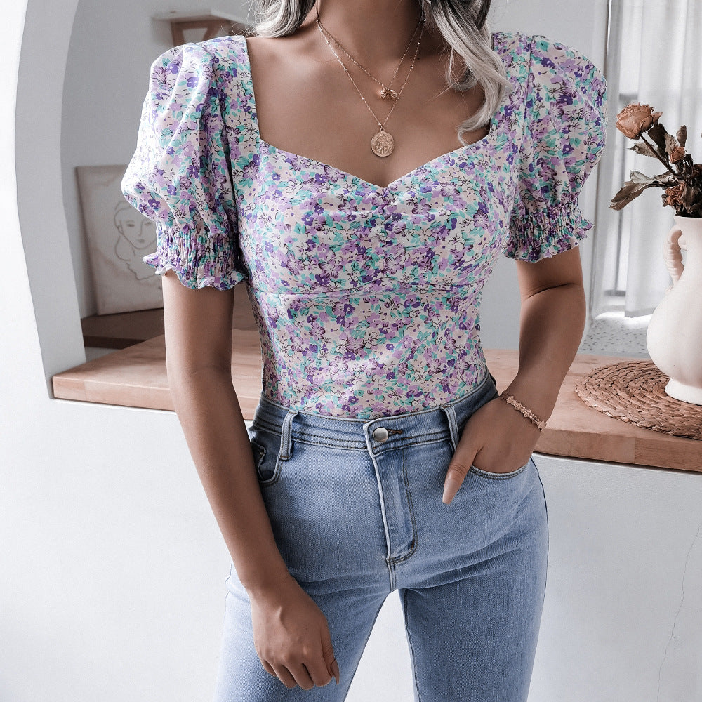 Damebluse i romantisk blomsterdesign med puffærmer Stilla