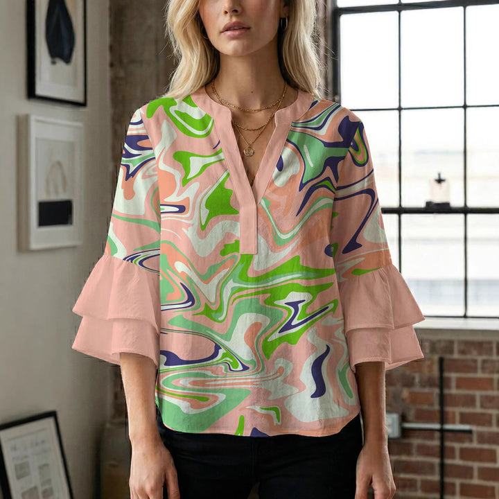 Dame bluse med voluminøse ærmer og kreativt trykdesign Skovae