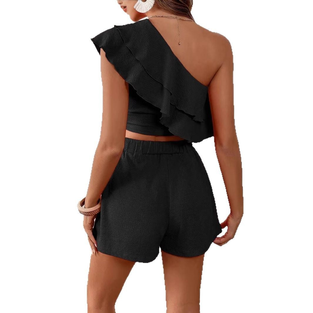 Dame top og shorts sæt med flæsedetaljer og asymmetrisk design Stilla