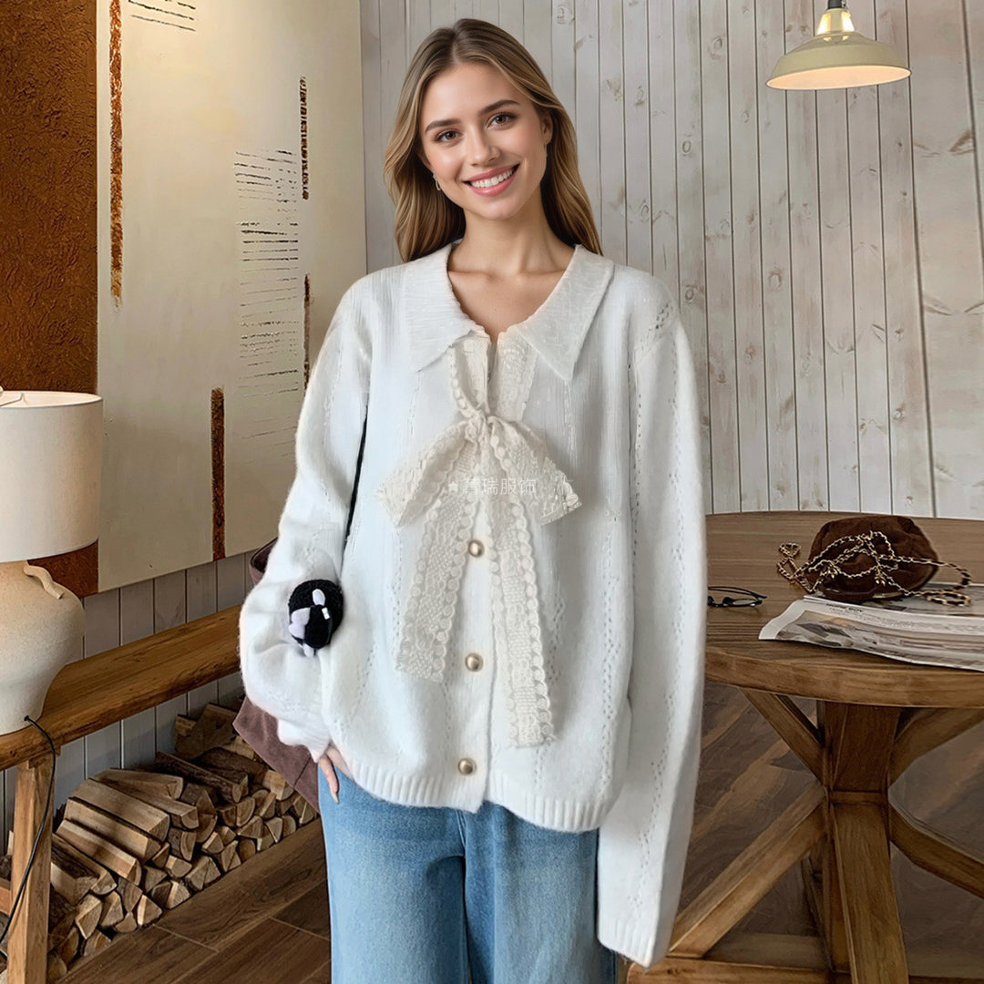 Kvinders strikket sweater med elegant sløjfe applikeret Stilla