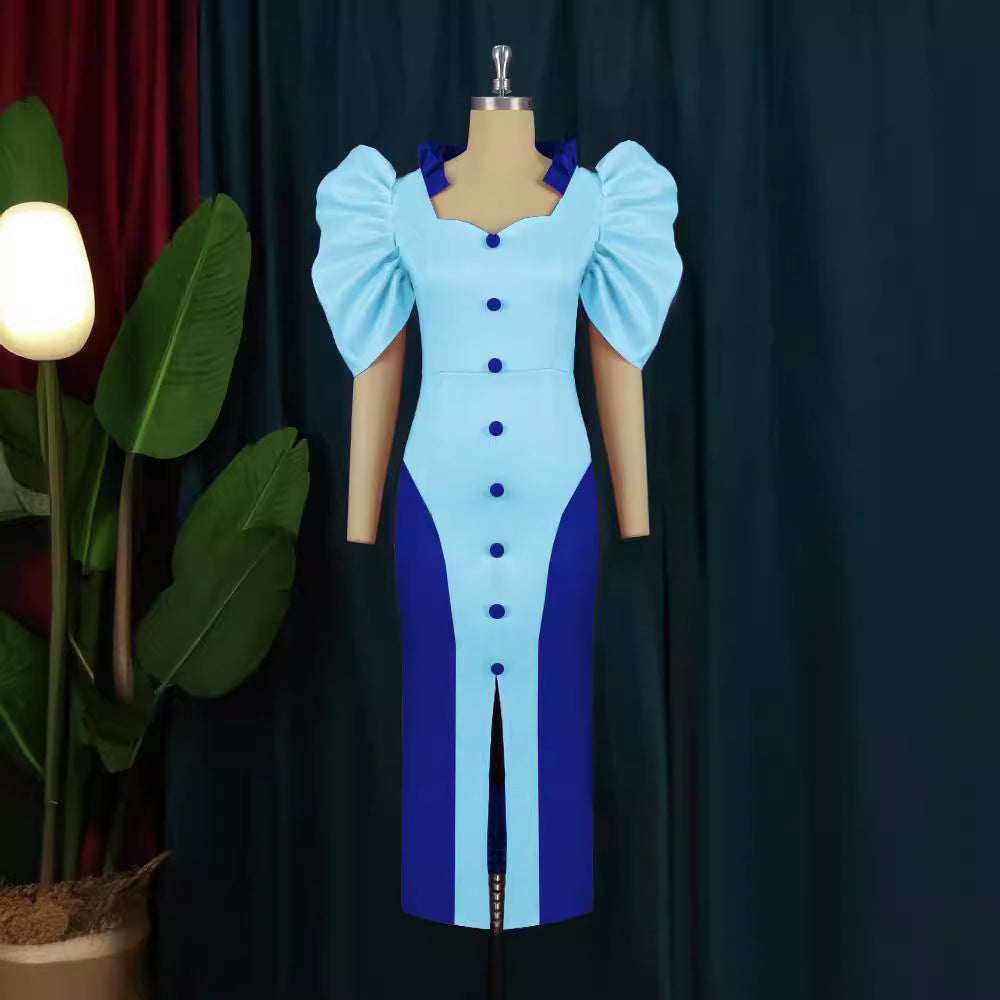 Dame cocktailkjole med voluminøse puffærmer og elegant split Skovae