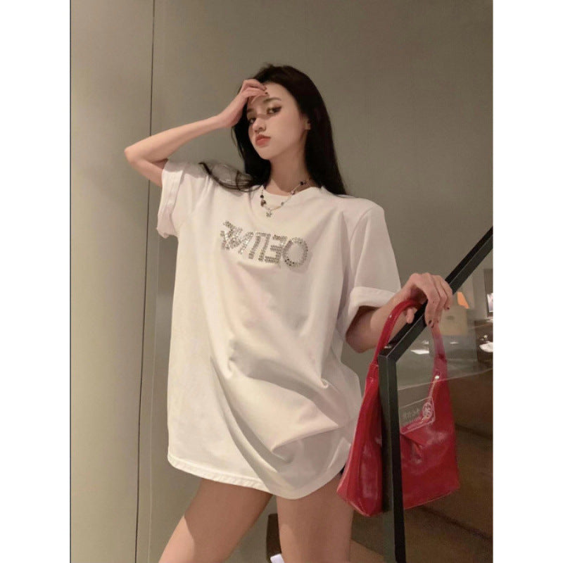 Dame T-shirt med glitrende skrift og afslappet oversized snit Stilla