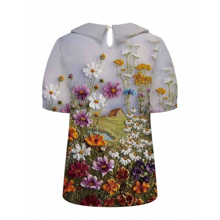 Dame kortærmet bluse med florale accenter og klassisk krave Skovae