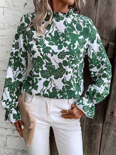 Damebluse med blomstret design og flæsedetaljer Stilla