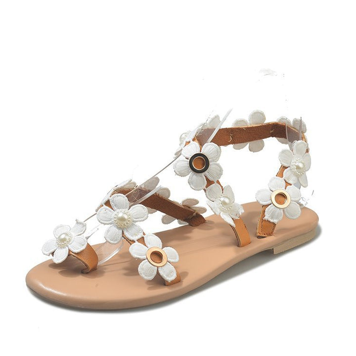 Dame sommerlige sandaler med elegante blomsterapplikationer og justerbare remme Stilla