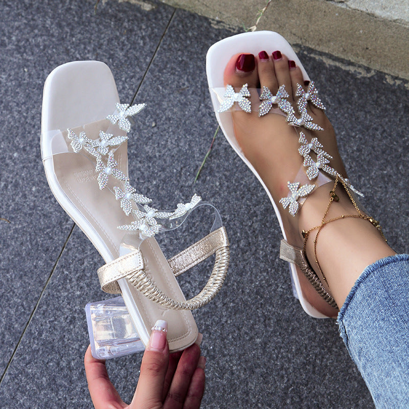 Dame Glitrende Sandaler med sommerfugleformede Applikationer og transparente Remme Stilla