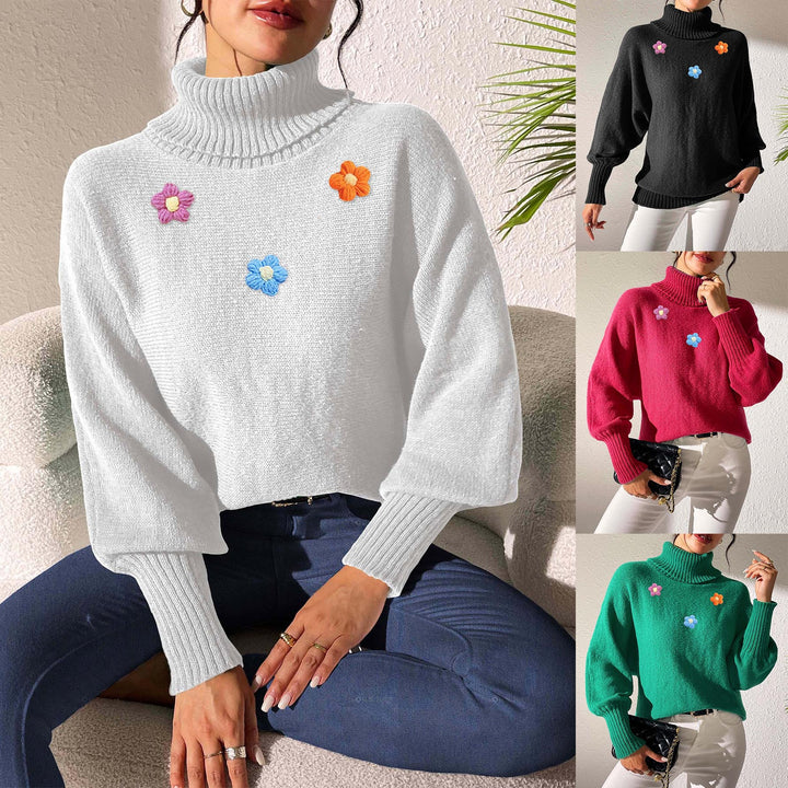 Dame moderigtigt strikpullover med høj krave og farverige blomsterapplikationer Stilla