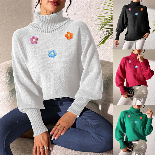Dame moderigtigt strikpullover med høj krave og farverige blomsterapplikationer Stilla