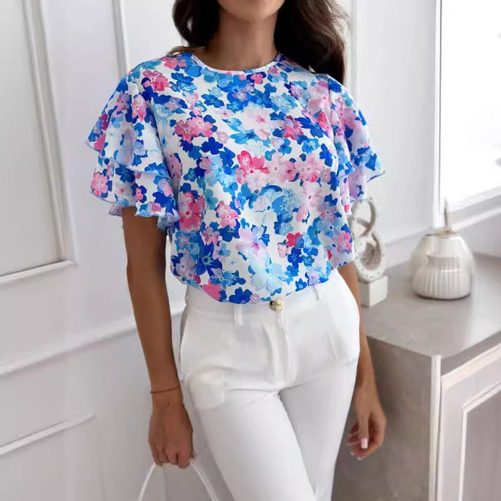 Damebluse med volumenfulde flæseærmer og blomsterprint Stilla