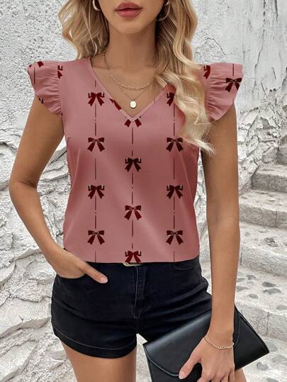 Dame blusenshirt med flæsedetaljer og legende sløjfemønster Stilla
