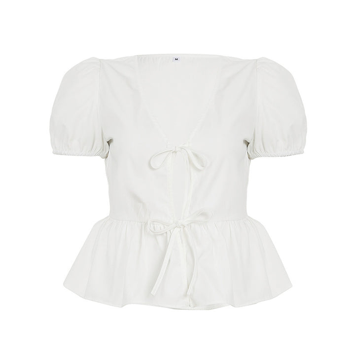 Dame indpakningsbluse med puffærmer og feminin peplum-kant Skovae