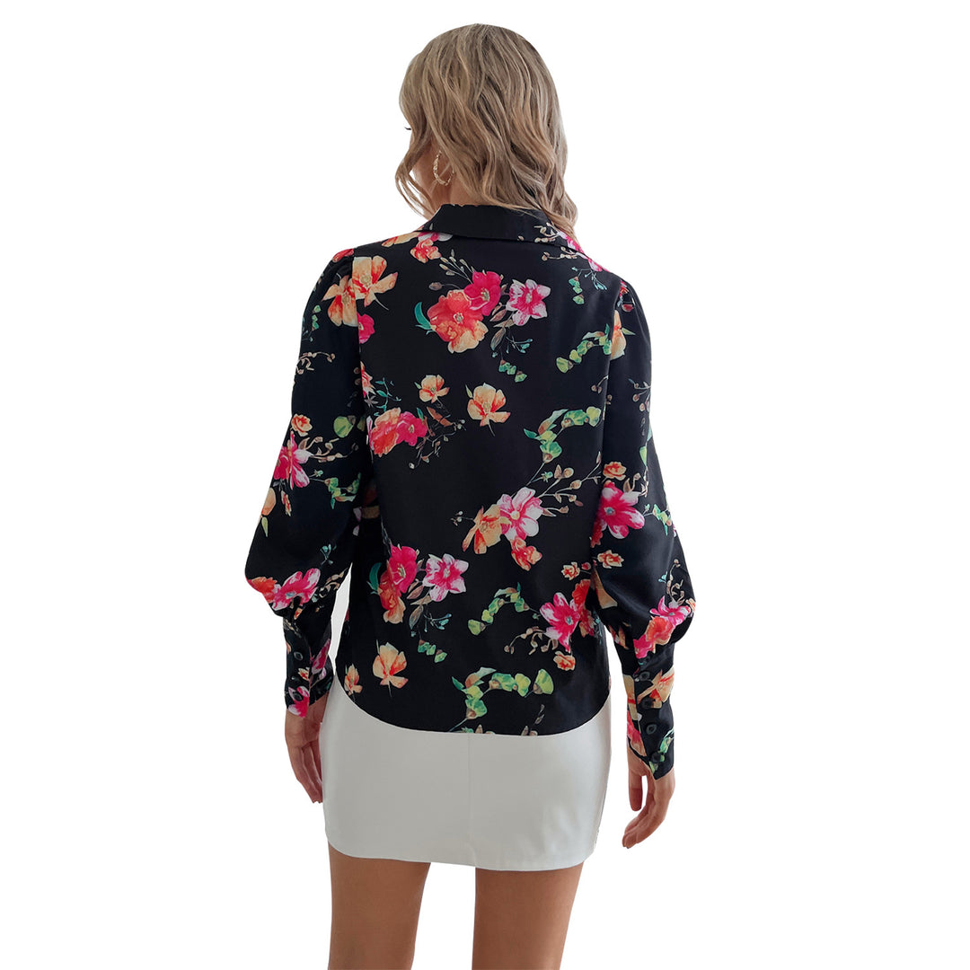 Kvindernes elegante bluse med blomsterprint og pufærmer Stilla
