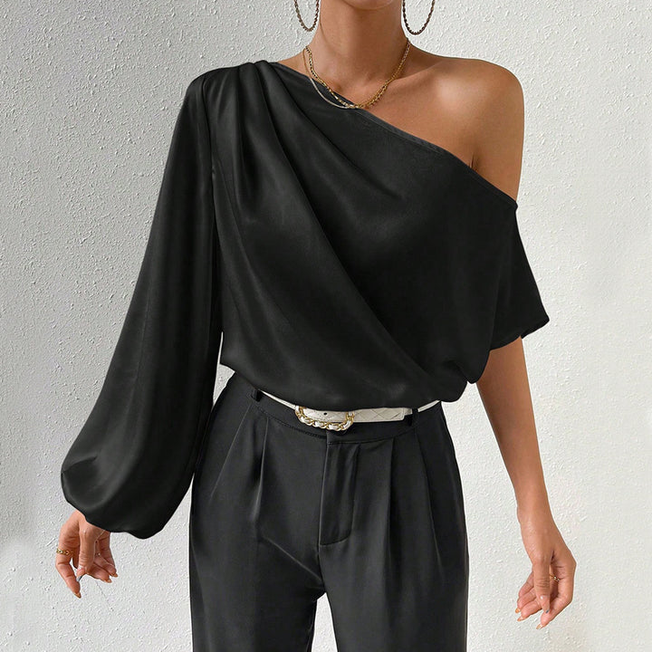Kvindernes asymmetriske top med elegante puffærmer Stilla