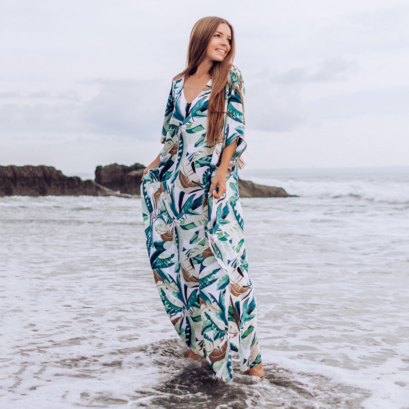 Dame strandkaftan med blomstermotiv og luftig pasform Stilla