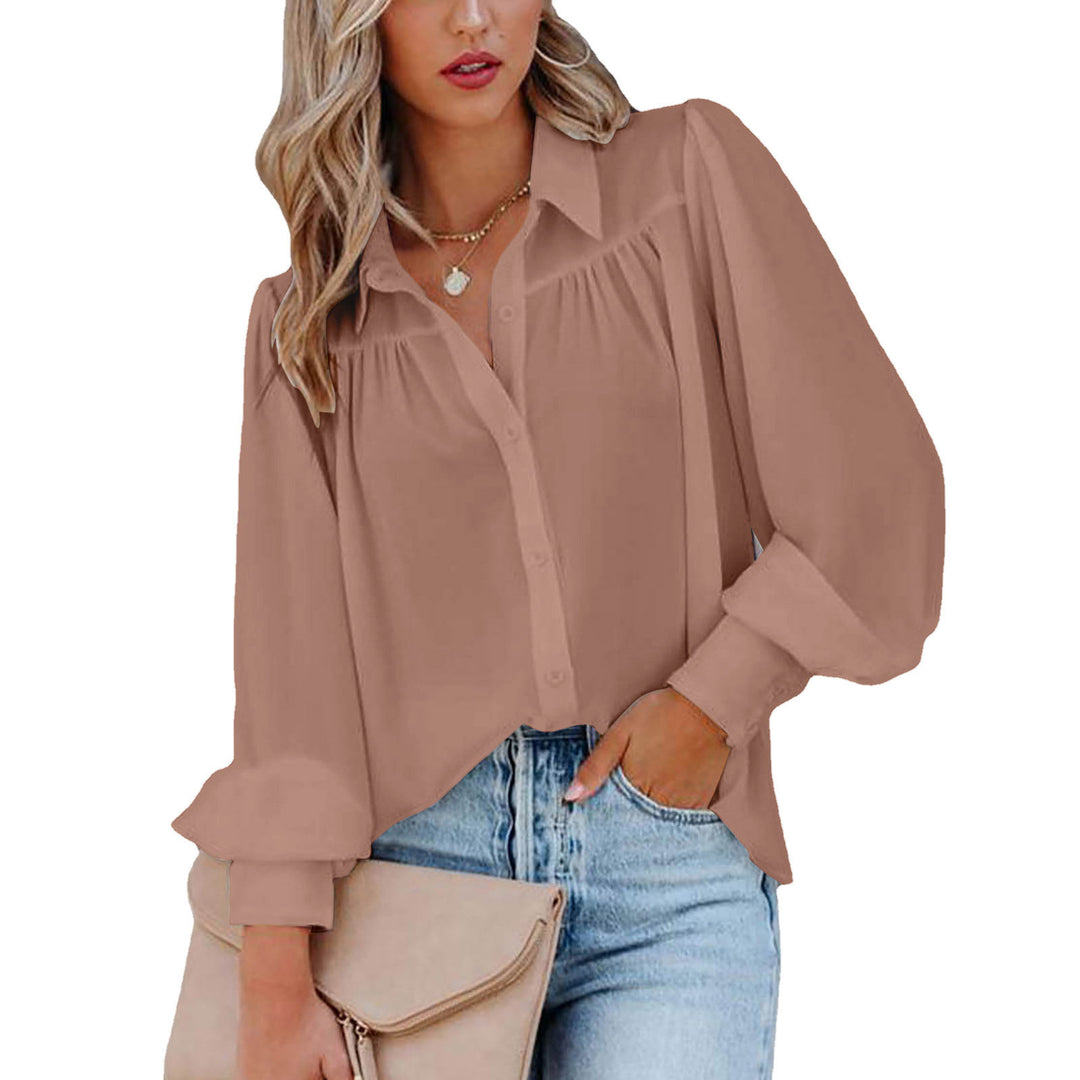Dame elegant bluse med voluminøse ærmer og knapdetaljer Stilla
