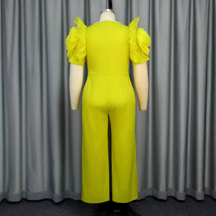 Dame elegant jumpsuit med voluminøse puffærmer og perleaccent Skovae