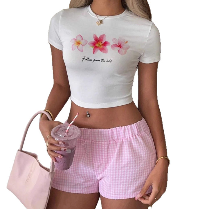 Dame Crop-Top med floraltryk og motiverende skrift Skovae