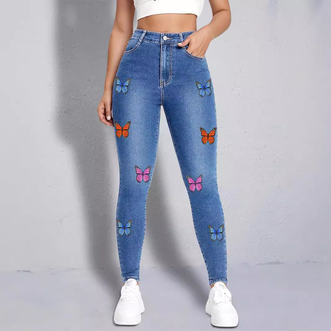 Dame Skinny Jeans med farverige sommerfugleapplikationer Stilla