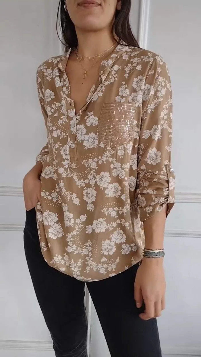 Damebluse med blomstret design og glitrende accenter Stilla
