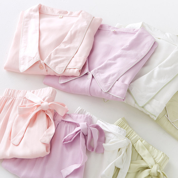 Dame natwear top med knaplukning og brystlomme Stilla