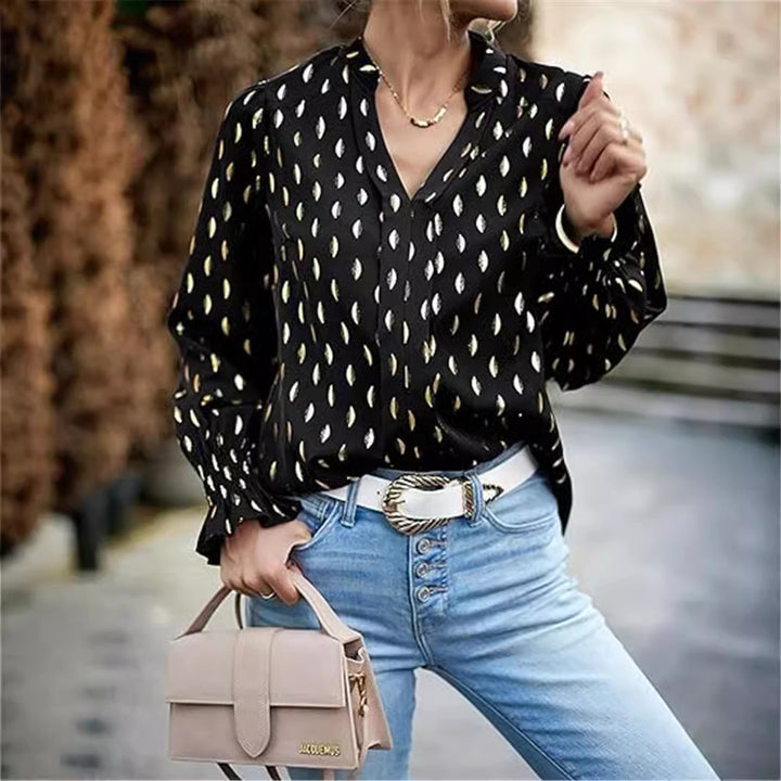 Damebluse med elegant guldmønster Stilla