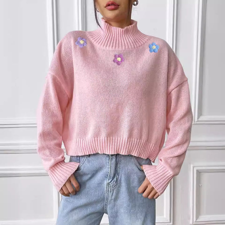 Dame elegant strikpullover med blomstret design og høj krave Stilla