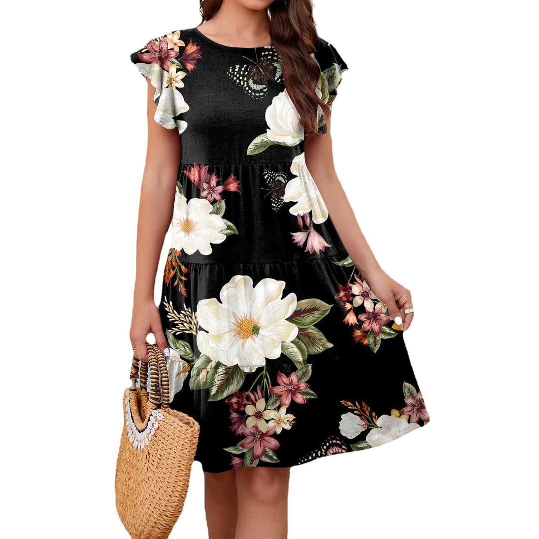 Dame flydende sommerkjole med blomstermotiv og ruffle detaljer Stilla