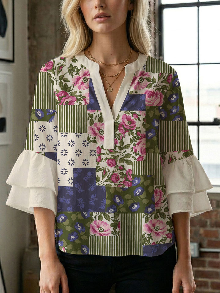 Dame bluse med voluminøse ærmer og kreativt trykdesign Skovae