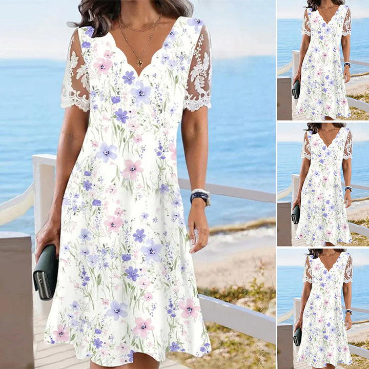 Dame fritidskjole med romantisk blomsterprint og spidse detaljer Stilla
