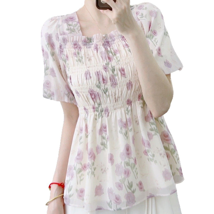 Damebluse med blomster smock-design og elastisk kant Stilla