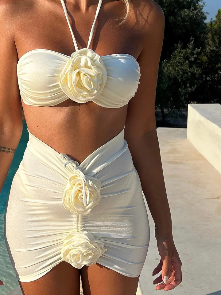 Dame Bandeau-top med legende blomsterapplikationer og smal mini-nederdel Stilla