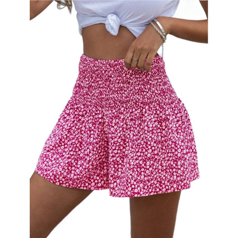 Dame shorts med elastisk taljebånd og blomsterdesign Skovae
