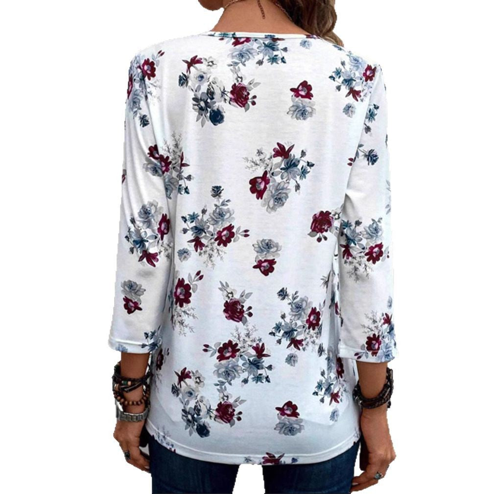 Dame blusenshirt med florale accenter og knappbart udskæring Stilla