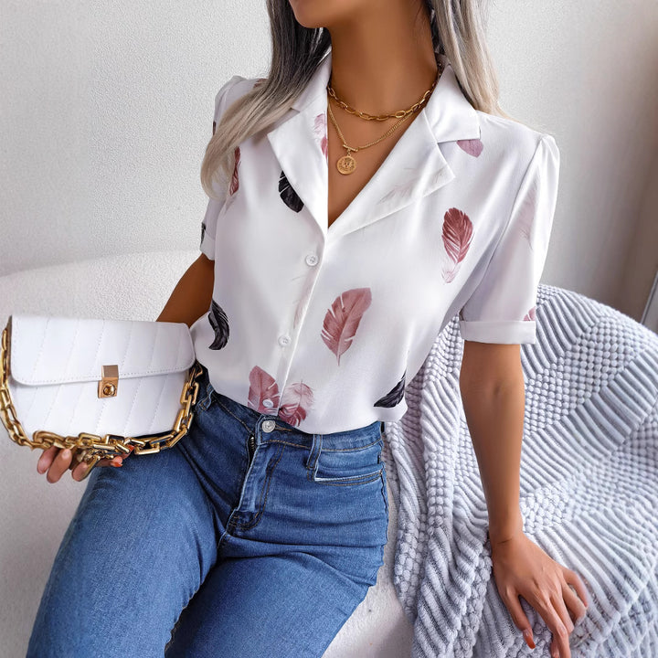 Damebluse med elegant fjerdesign Stilla