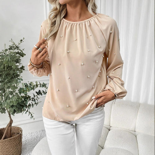 Damernes elegante bluse med perleprydede detaljer og brede ærmer Stilla
