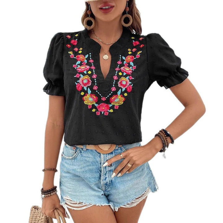 Damebluse med florale broderier og voluminøse ærmer Stilla