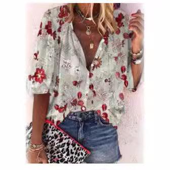 Damebluse i transparent spids med blomsterapplikationer og knapliste Stilla